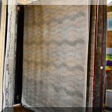 R81. Handcrafted wool rug with wave design.